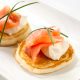 Blini topped with smoked salmon and sour cream.